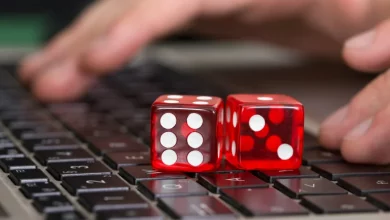 a pair of red dice on a keyboard